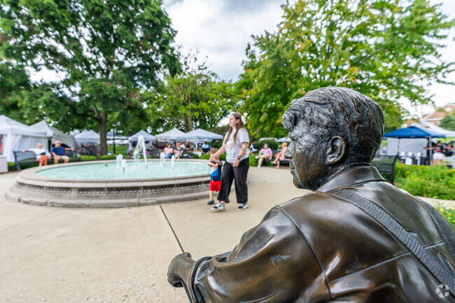 The fountain in Burlington Park next to the Robert Frost statue attracts many visitors.
