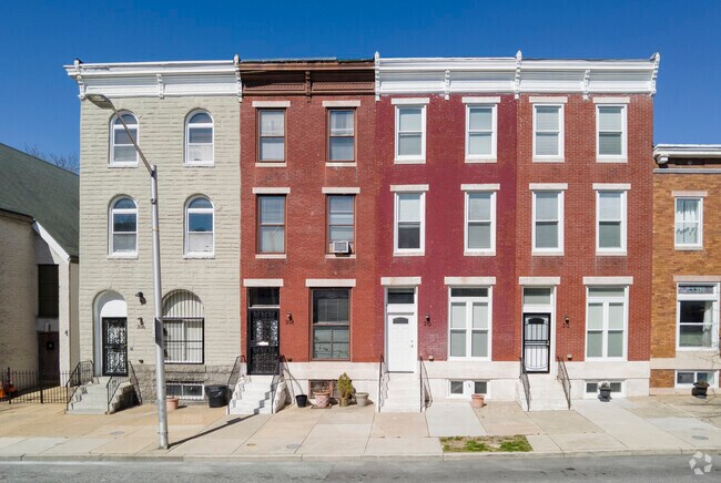 Most row homes in the Barclay neighborhood feature a classic red brick facade.