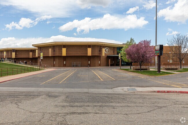 Sand Ridge Junior High in Roy is a sprawling campus with multiple buildings that houses classrooms, labs, and administrative offices.