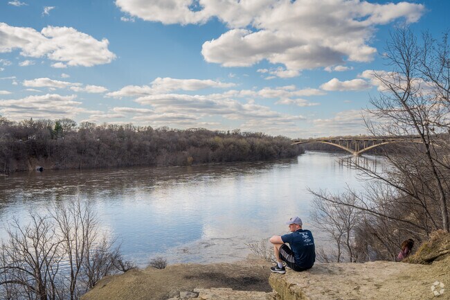 Locals enjoy river bluff view at Shadow Falls Park in the Macalester-Groveland neighborhood.