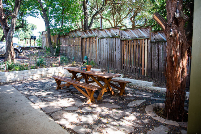 Shaded patio and yard, fenced in.