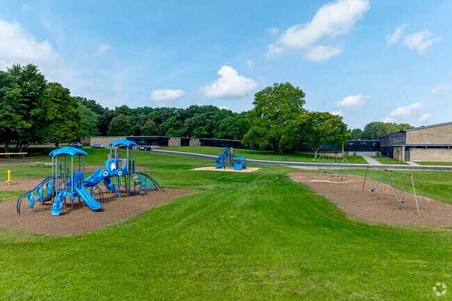 Play structures behind Hunt Elementary beckon kids to play during recess.