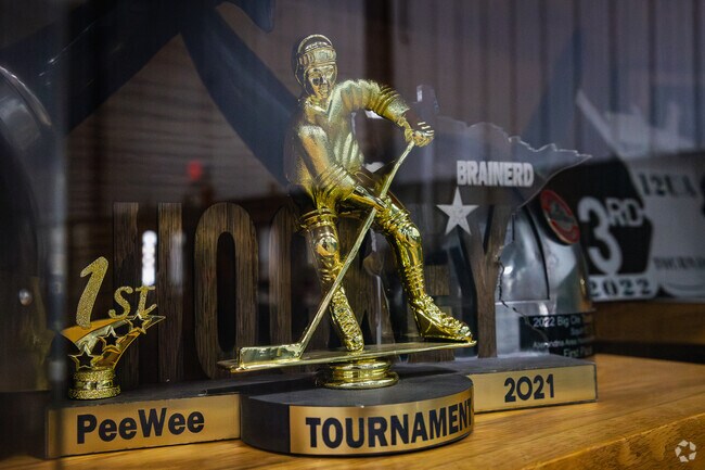 Find trophies on displays from local hockey leagues at Veterans Memorial Arena near Berger.
