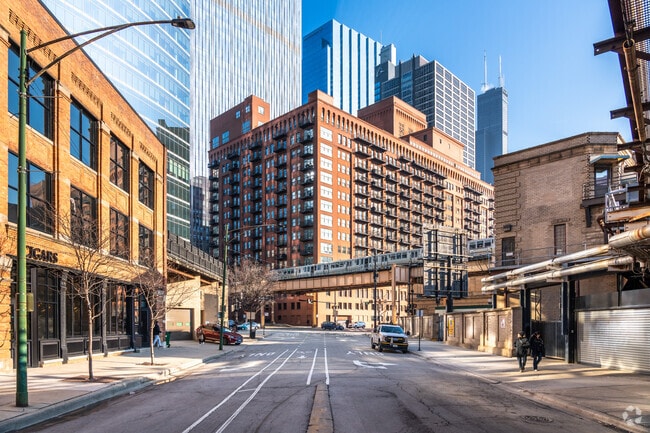 There are brick midrise condo buildings with access to public transportation in West Loop Gate.