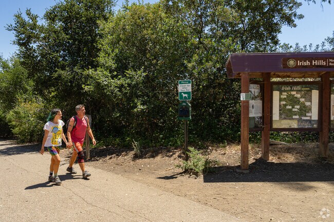 A Billygoat Acres couple start their morning walk at the trailhead of the Irish Hills.