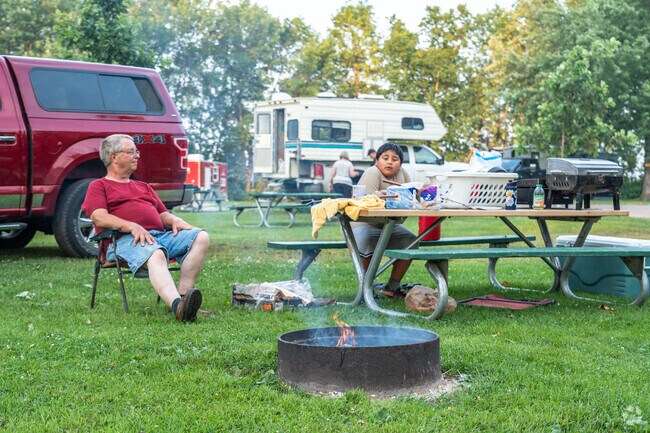 A family enjoys their evening campfire at Indian Point Campground in Irving.