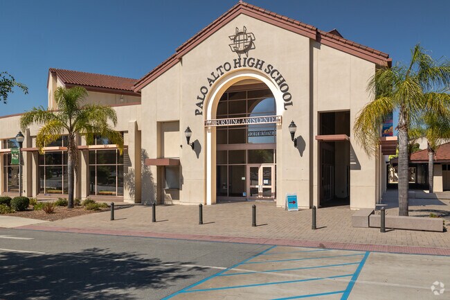 The front entrance at Palo Alto High School in University South is flanked by petit palm trees.