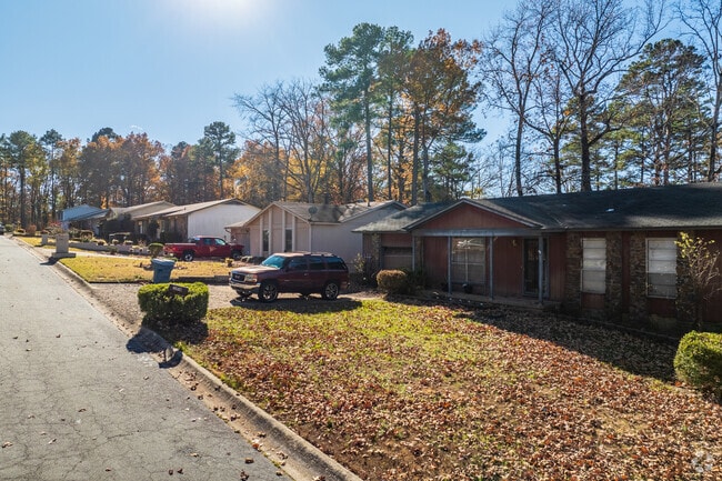 The neighborhoods in John Barrow are filled with large, mature trees.