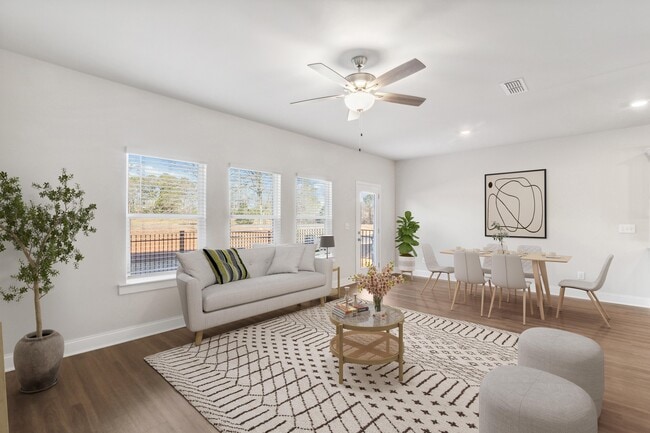 A view of the living room and intimate dining space