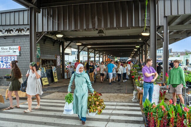 Oakman Boulevard Community residents enjoy the Flower Market at Eastern Market.