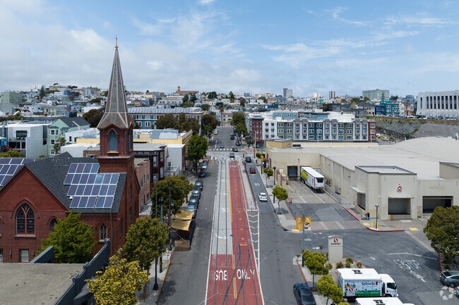 A view of Church Street towards Duboce Triangle, Safeway and Muni stop.