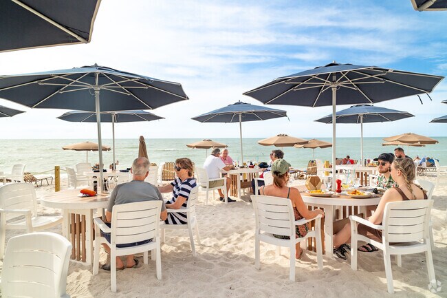 On a sunny day, dining on the sandy beach at The Turtle Club is the place to be.