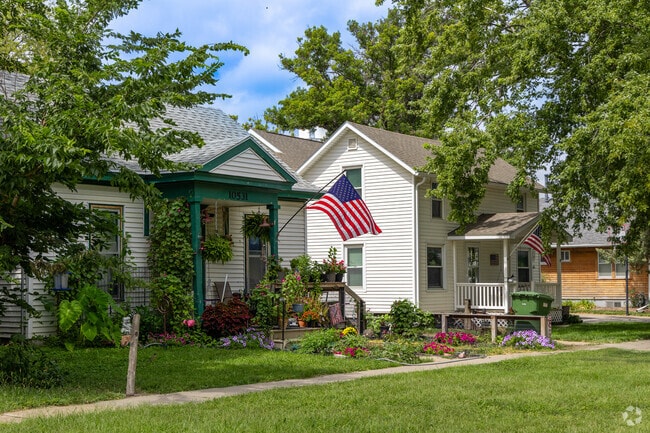 Midcentury homes line a quiet Waverly street shaded by mature trees.