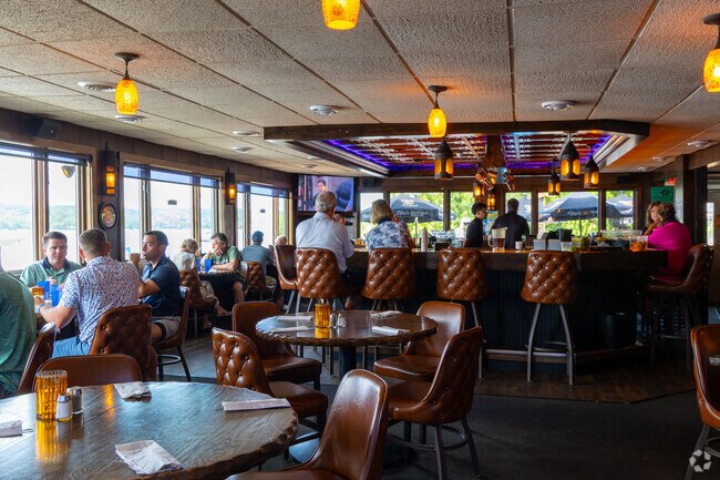 Diners enjoy lake views and rustic wood tables at Mars Resort in Como, Wisconsin.