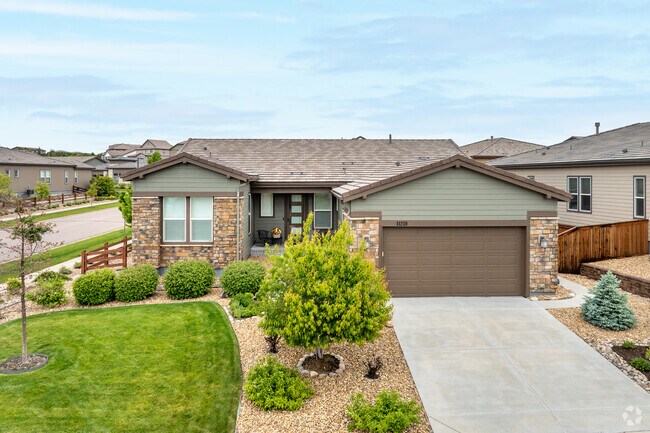 Traditional-style homes in Stepping Stone, offer timeless curb appeal with natural stone facades, warm wood accents, and inviting front porches, which create a welcoming atmosphere.