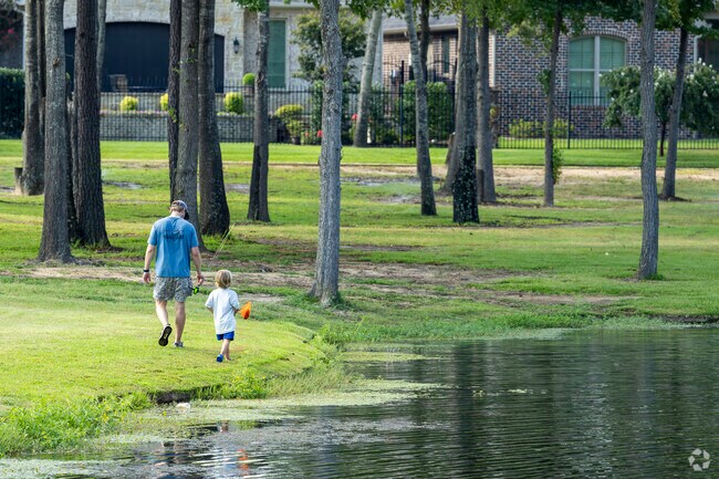 A father and son fish the ponds located in The Crossings neighborhood.