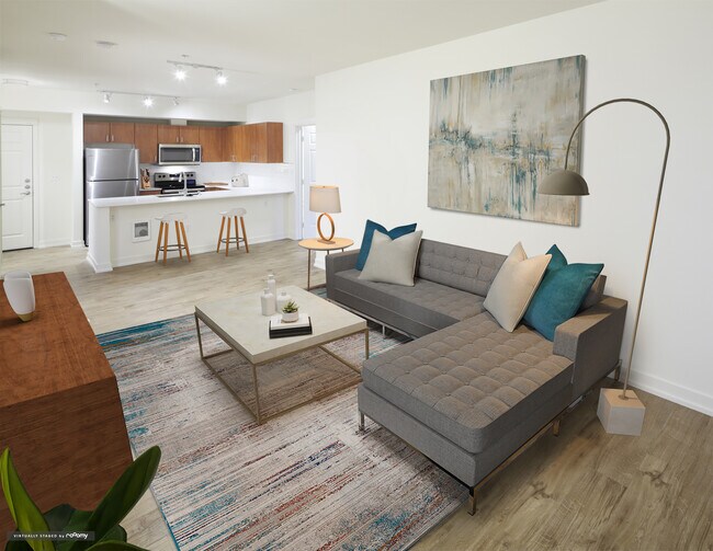 Renovated Package I kitchen and living area with hard surface flooring