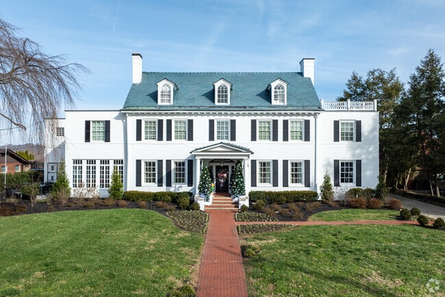 A large colonial estate sits on the banks the Ohio River in Highlawn.
