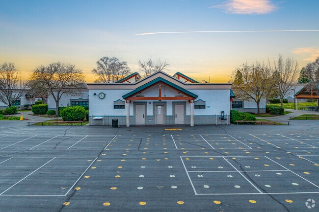 Sun sets behind Oakhills Elementary School.