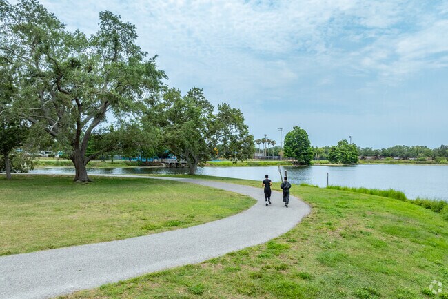Friends exercise around the lake path at Ed Wright Park near Brookhill.