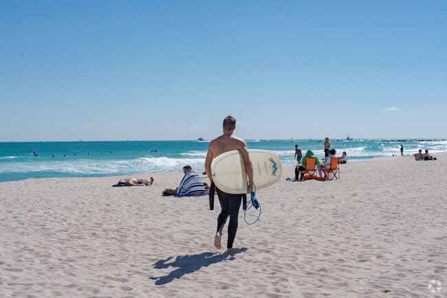Fisher Island residents are minutes away from the surfing waves of Miami Beach.