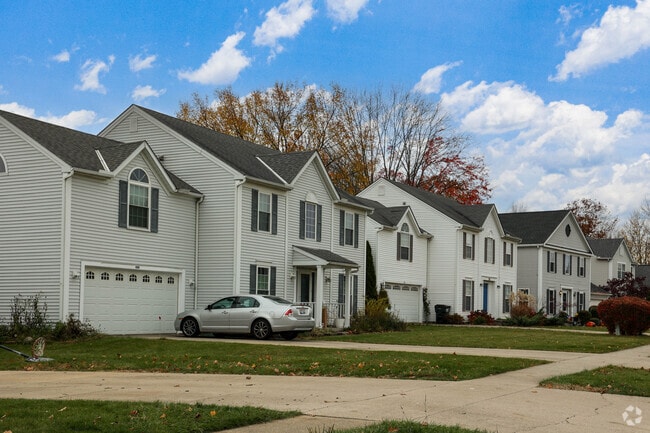 A row of colonial style homes, lines a quiet street in Streetsboro.