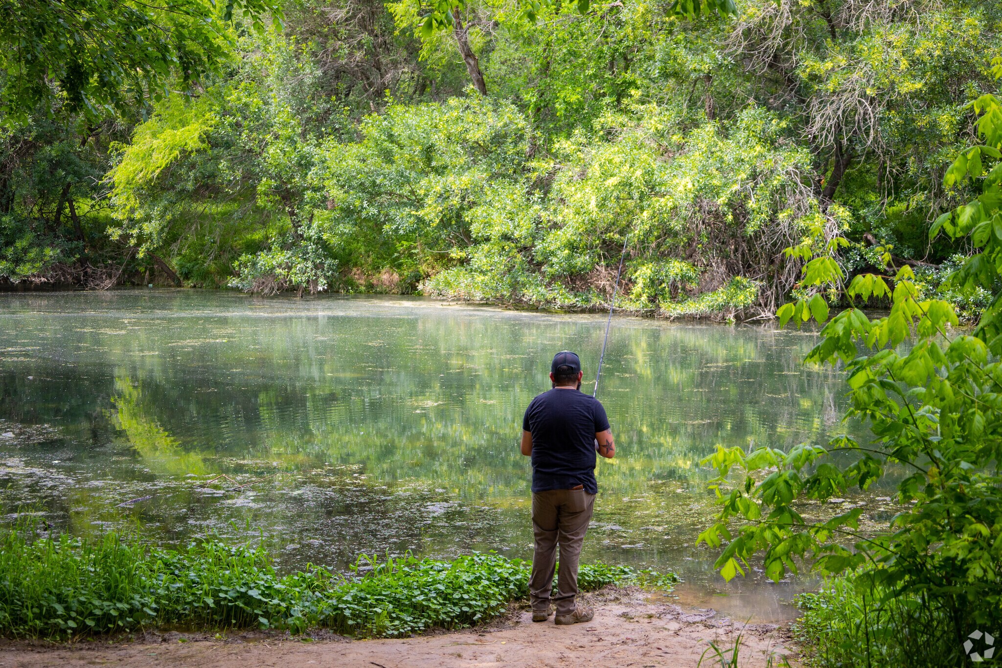 Locals enjoy a peaceful time fishing at Crescent Bend Park in Cibolo.