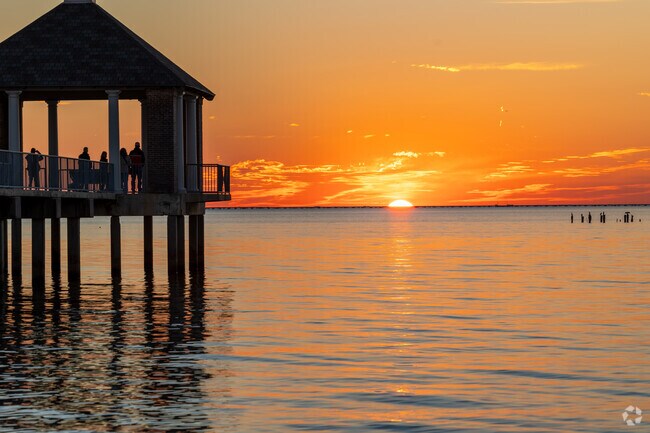 Watch the sun dip below the horizon from the pier at Fontainebleau Park.