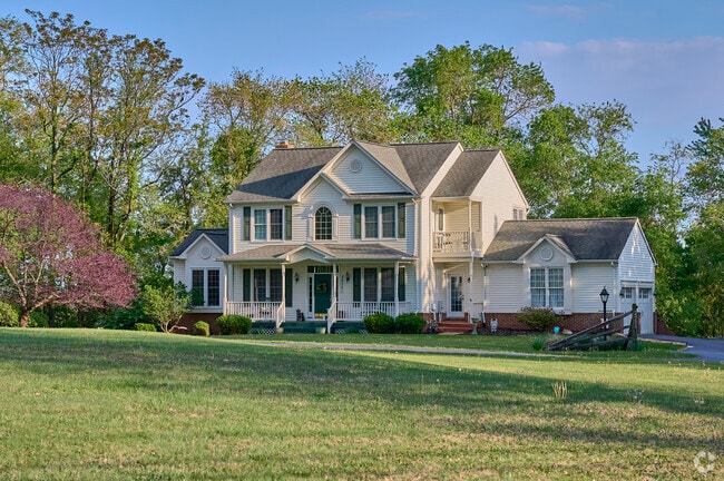 A two-story single-family home stands in Damascus, Maryland.