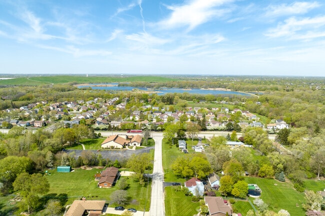 View of Keeneyville showcasing a variety of home styles and Mallard Lake.
