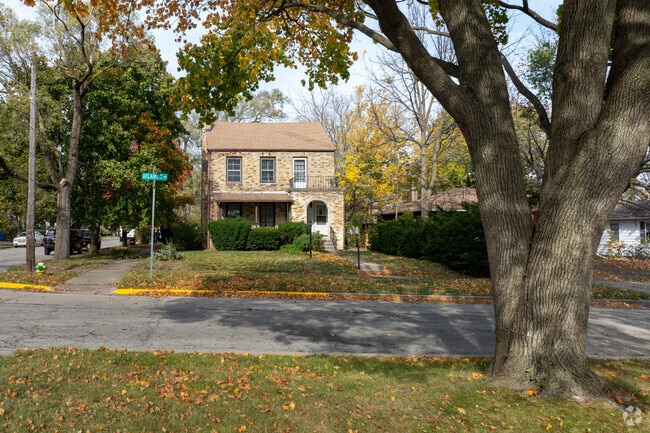 Mature trees line the sidewalks of Marquette Highlands.