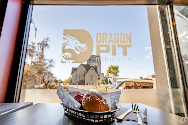 Dragon Pit near Slausondale specializes in wood-fired BBQ with secret family rub recipes.