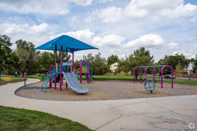 The playground at Columbine Park features lively swings and thrilling slides that keep kids smiling all day.