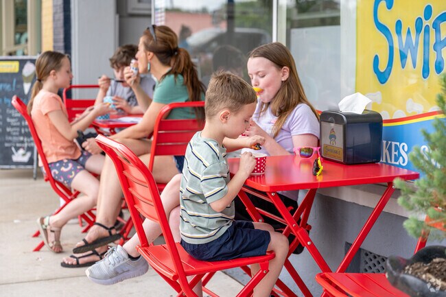 Indulge in a delightful and refreshing sweet treat from Swirlee's as you soak up the vibrant atmosphere of the annual Jefferson Porch Fest, a festive celebration filled with music, laughter, and community spirit.