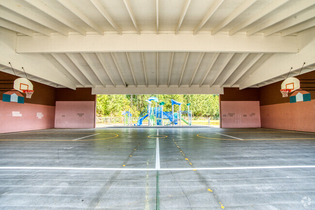 Indoor basketball court for students to enjoy during recess or on rainy days.