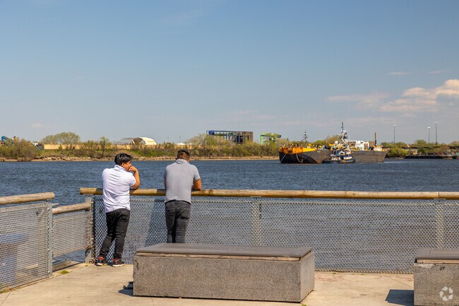 Look out over pier 68 along the Delaware River as ships pass by.