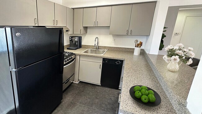 Today's kitchen designed for easy care with breakfast bar, no fuss flooring.