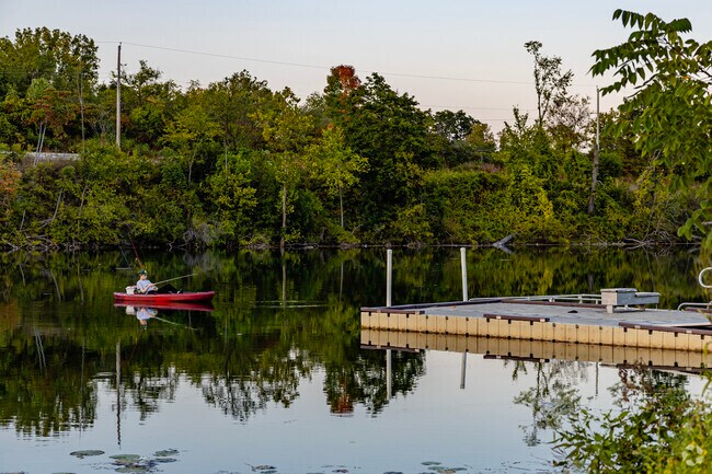 Fisherman take to the lake at Pinhook Park to enjoy the serene fishing experience.