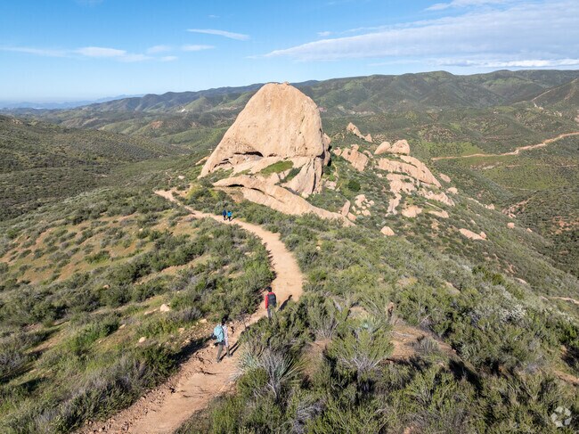 People hike to the Texas Canyon rock formations in Agua Dulce.
