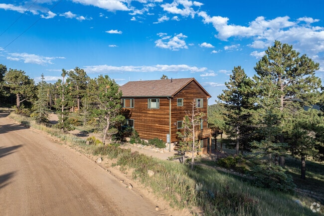 Surrounded by aspen trees and overlooking the Indian Peaks, Bar-K Ranch is secluded and serene.