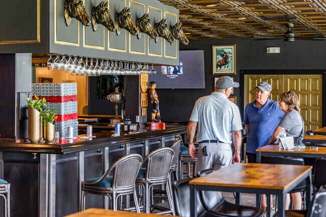 Residents enjoy a refreshing drink at the newly renovated restaurant and bar at Ocala National Golf Club.