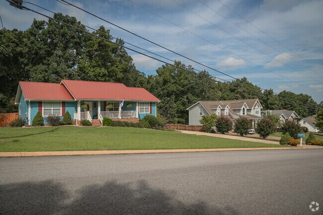 This blue rancher brings a pop of color to this Graysville street.