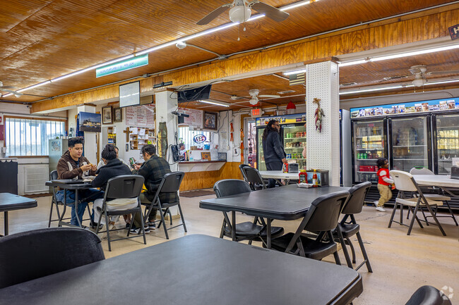 Local youths enjoy a delicious seafood meal at the popular Bluebird\ Fish Camp.