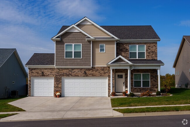 A mix of exterior textures enhances this two-story South Nicholasville home.