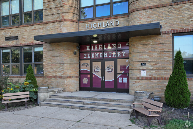 The main ebtrance to Highland Elementary School is covered in colorful art.