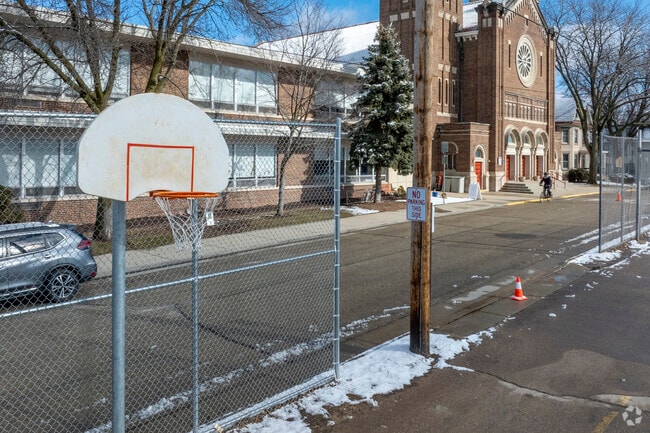 There's a basketball court in the parking lot next to St James Catholic School in Madison.