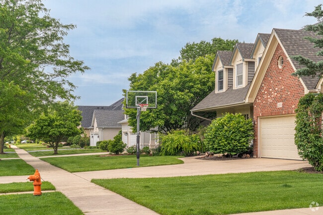 Wood Lake has new traditional homes with perfectly manicured lawns.