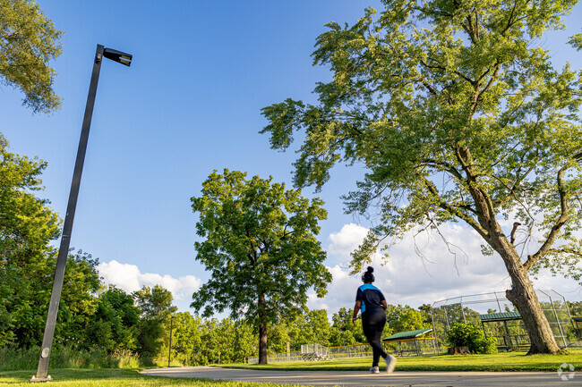 The paved trail at Howard Woods Recreation Complex is popular for walkers and cyclists.
