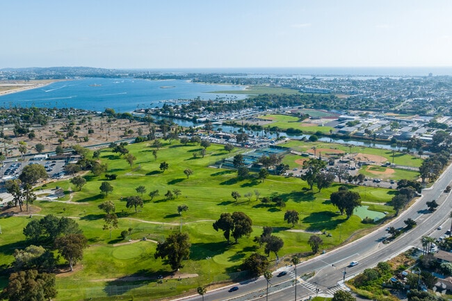 An elevated view shows the Mission Bay Golf Course and nearby athletic area in Pacific Beach.