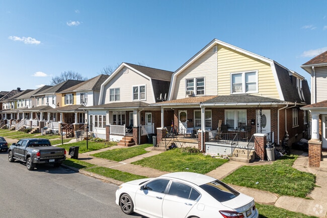 The Wilson duplexes sport a roofline that mimics the Swedish Colonial style.